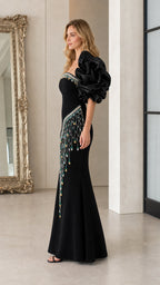 Side profile of black formal dress showing fitted silhouette