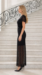 Side profile view of black lace maxi dress