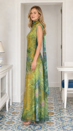 Model wearing yellow printed maxi dress, side profile view