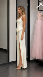 Side profile of model wearing ivory two-piece set
