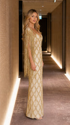 Side profile of champagne beaded evening dress