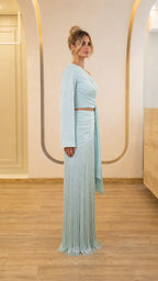 Side profile view of light blue two-piece set