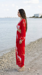 Side view of red abstract print cutout maxi dress