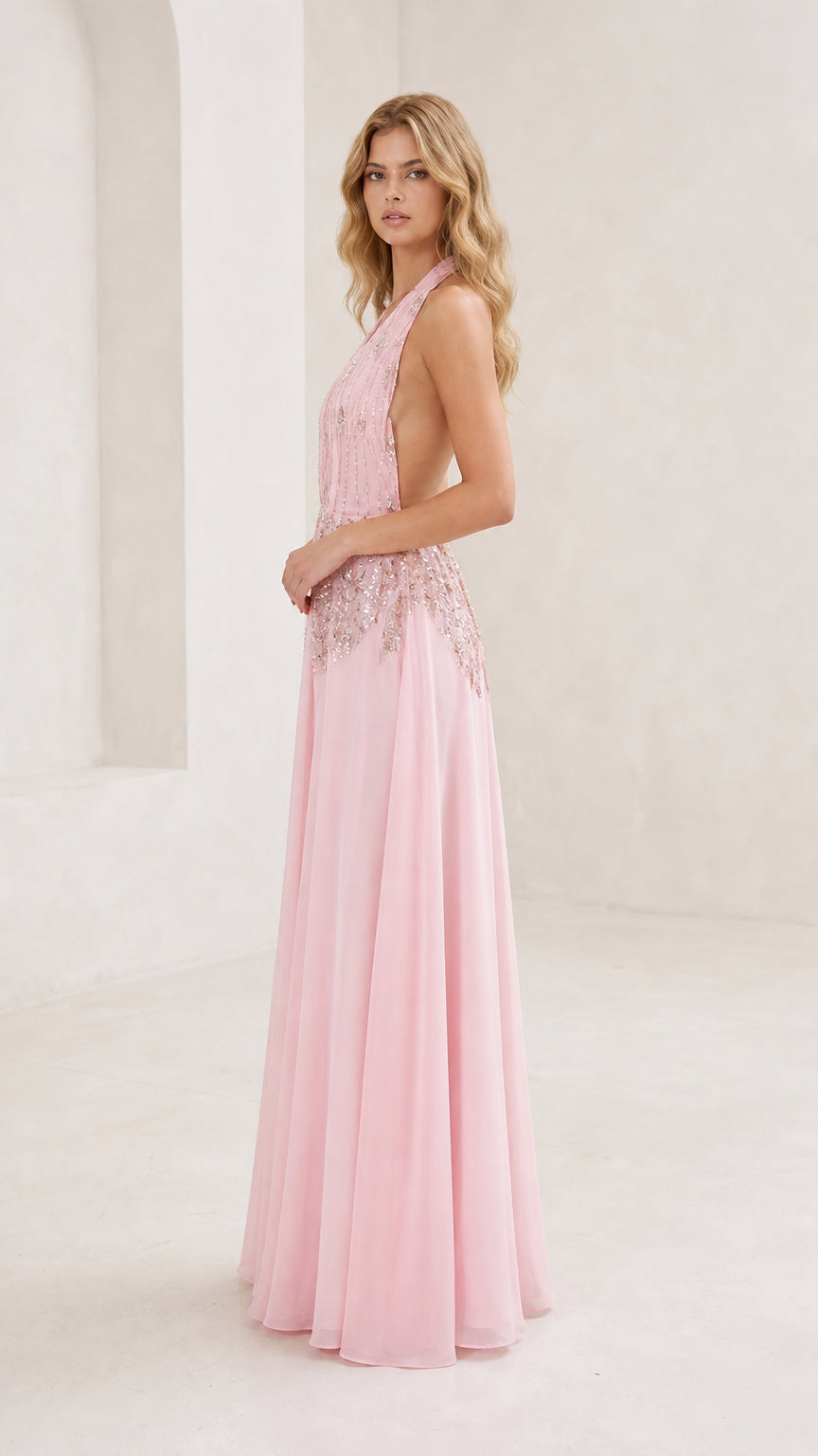 Side profile of pink evening gown on model