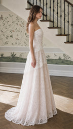 Side profile view of champagne lace evening dress