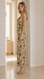 Side profile of model in the gold sequin dress
