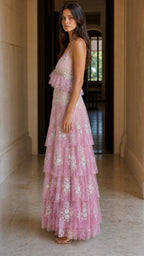 Side profile view of pink tiered maxi dress