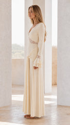 Side profile view of ivory maxi dress with knot detail