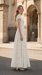 Side profile view of ivory floral embroidered maxi dress