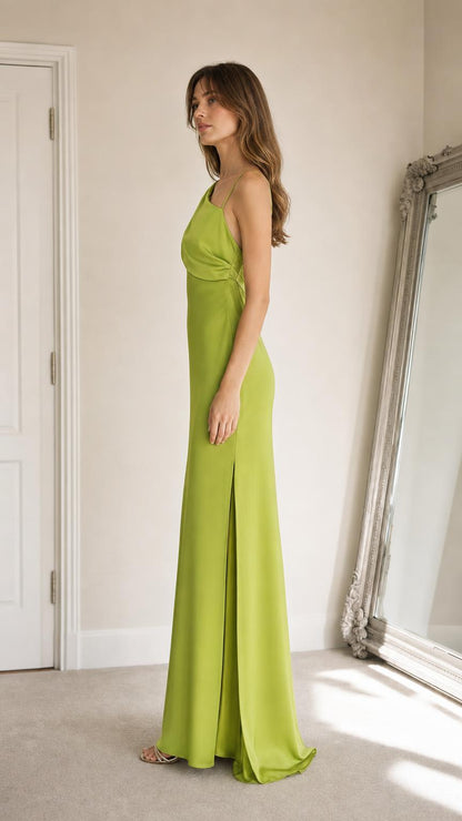 Side profile of lime green one-shoulder maxi dress with slit