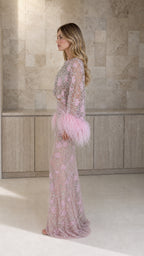 Side profile view of pink feather trim crop top and maxi skirt set