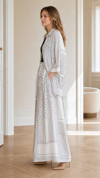 Side profile view of model wearing white coordinate set