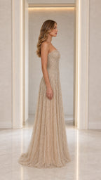 Side profile view of Champagne beaded formal gown