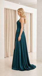 Side profile view of teal corset evening gown
