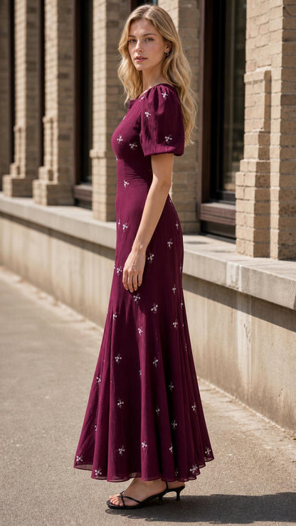 Side profile view of burgundy maxi dress