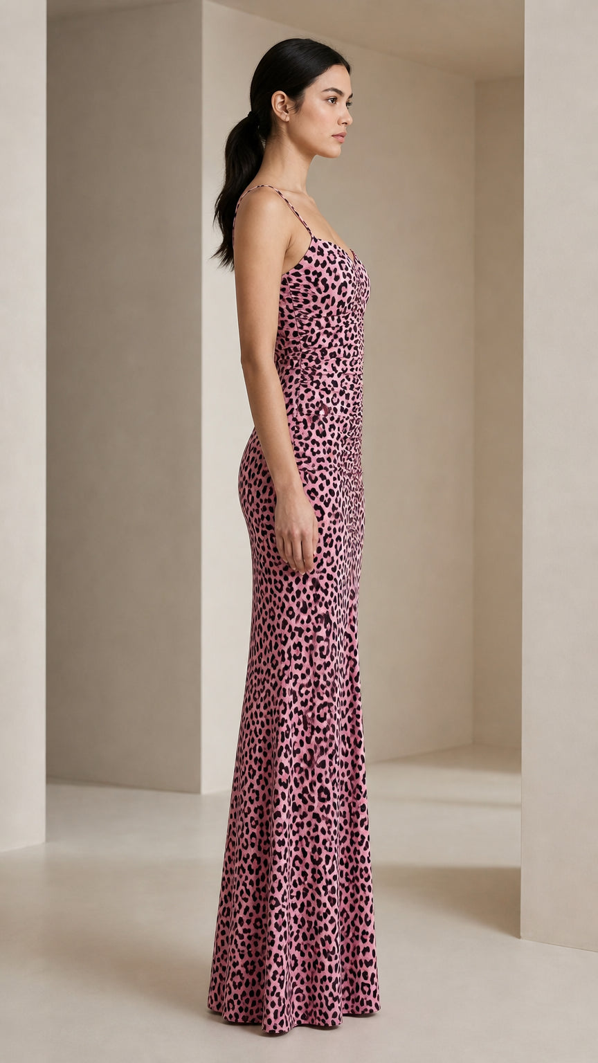 Side profile view of pink leopard print maxi dress