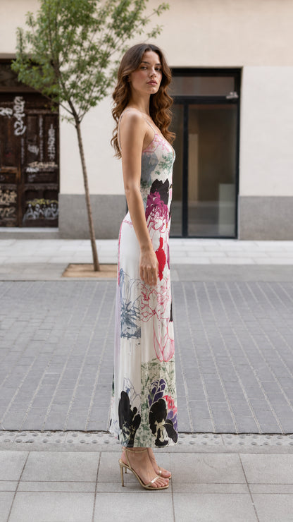 Side profile view of model in White floral maxi dress