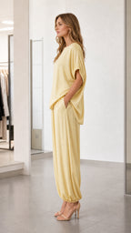 Side profile of model in yellow relaxed fit lounge set