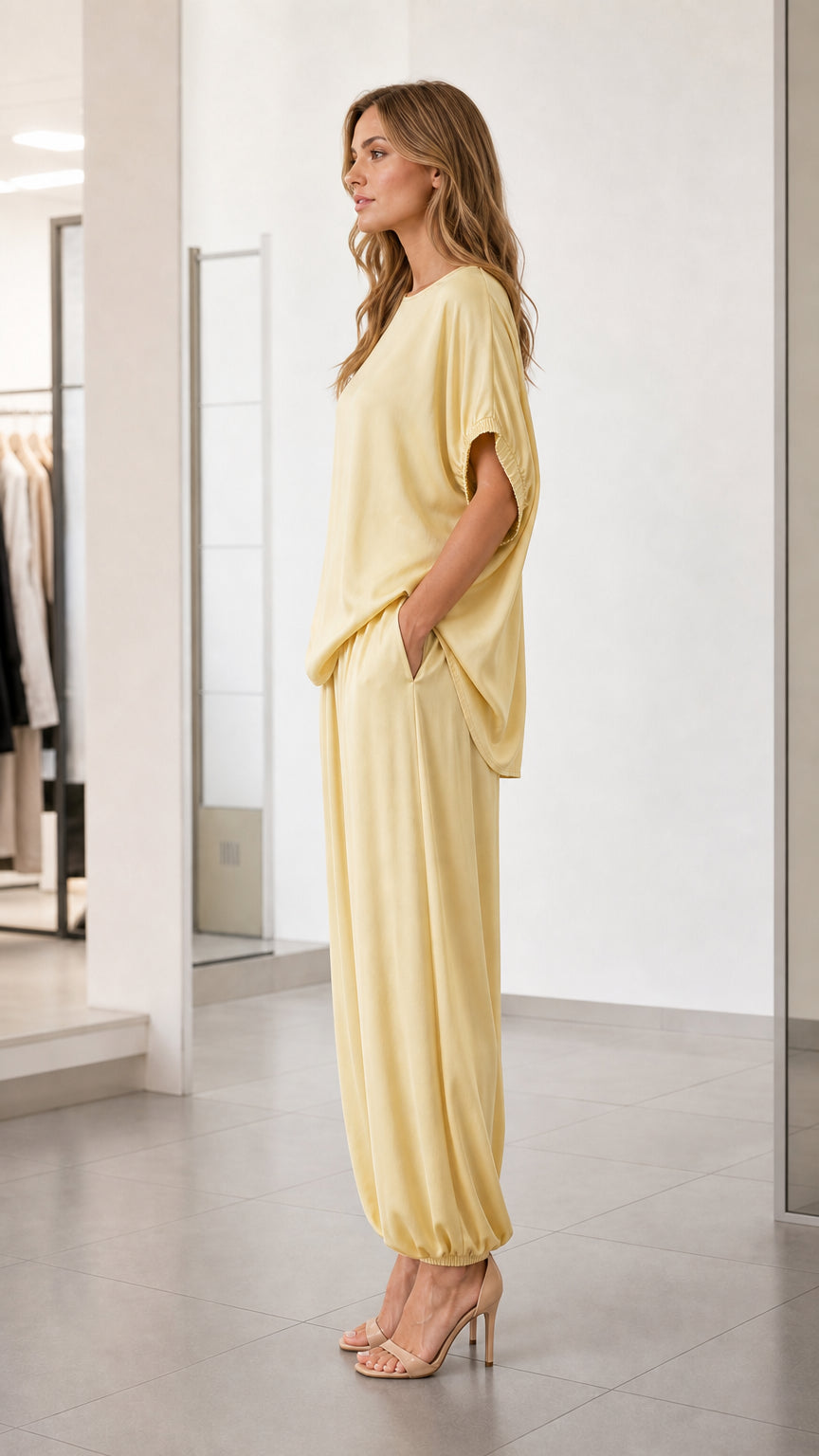 Side profile of model in yellow relaxed fit lounge set