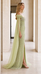 Side profile view of sage green gown showing side slit and cape