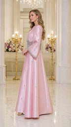 Side profile of model in pink evening gown