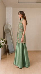 Side profile of model in sage green two-piece outfit