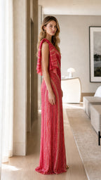 Side profile view of red sequin evening gown