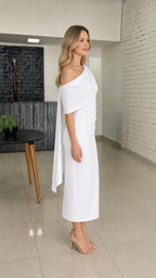 Side profile view of white one-shoulder cape dress