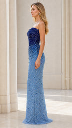 Side profile view of model in blue ombre beaded evening gown