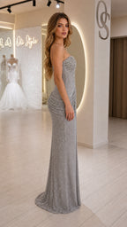 Side profile of model in silver sequin formal gown