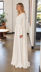 Side profile view of white sequin maxi dress with long sleeve