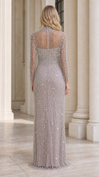 Back view of model showcasing detailed back of beaded gown