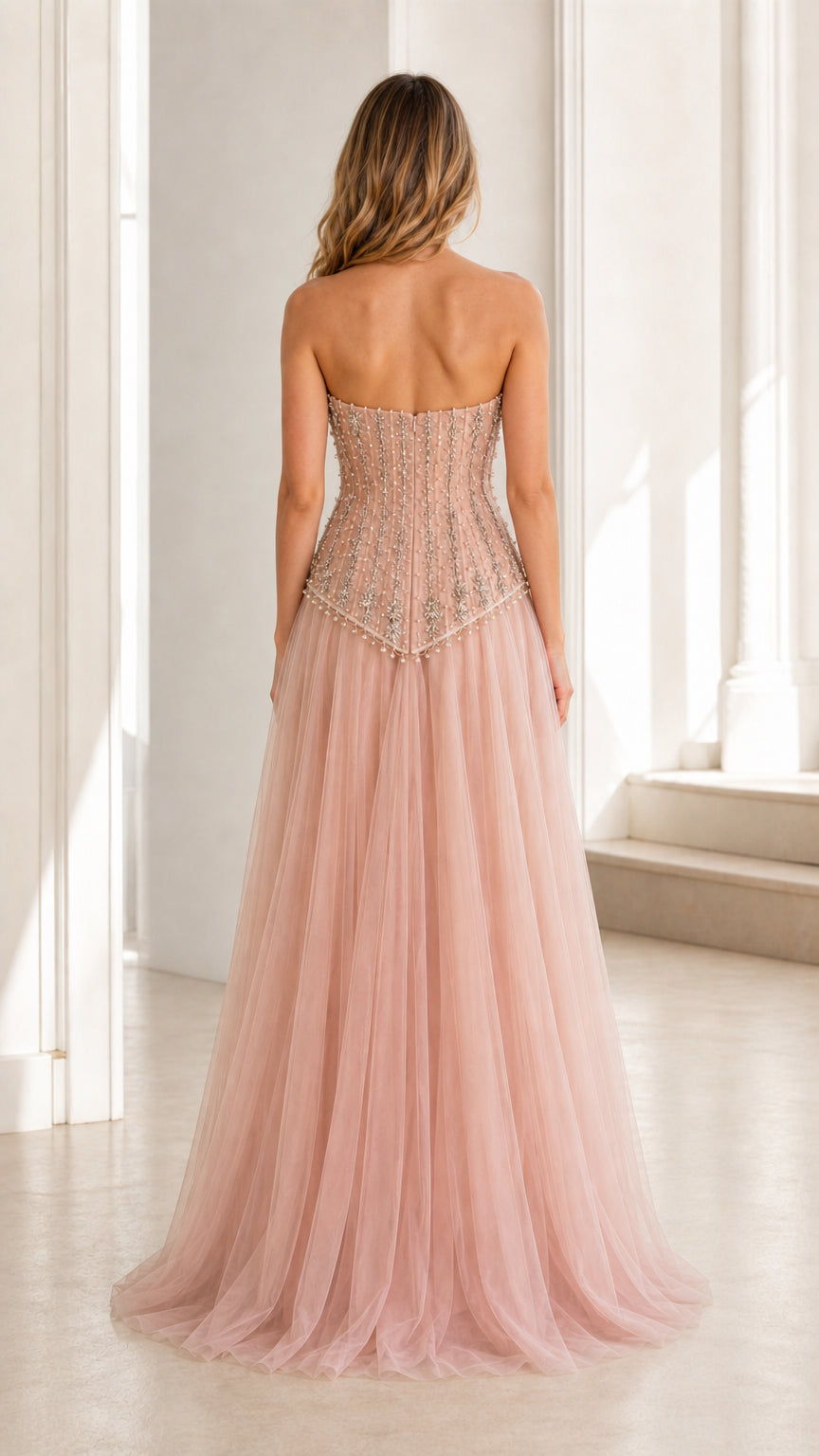 Back view of pink embellished strapless tulle evening gown