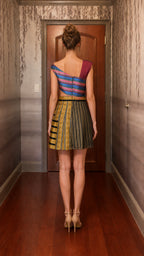 Back view of gold striped cutout mini dress