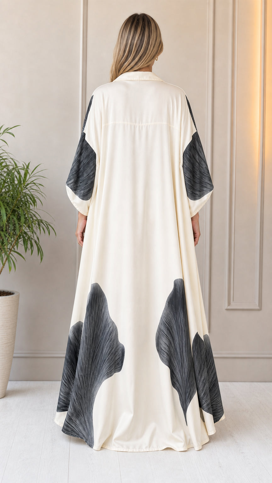Back view of woman showcasing the flowing duster coat
