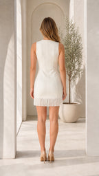 Back view of white fringe mini dress