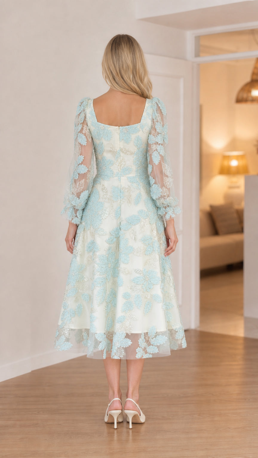 Back view of model in mint mesh midi dress