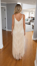 Back view of model in champagne fringe maxi dress