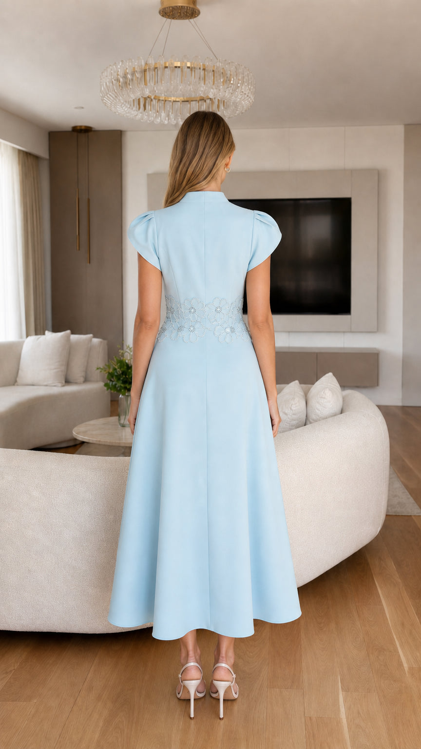 Back view of light blue A-line midi dress