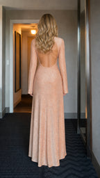 Back view showcasing open back design of champagne glitter dress