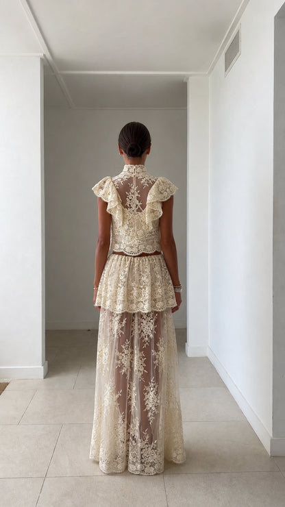 Back view of model in ivory lace two-piece set
