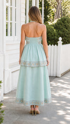 Back view of mint embroidered halter midi dress