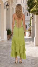 Back view of olive green maxi dress showcasing lace-up back detail