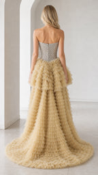 Back view of champagne dress showing long tulle train