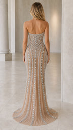 Back view showcasing sweep train on nude evening gown