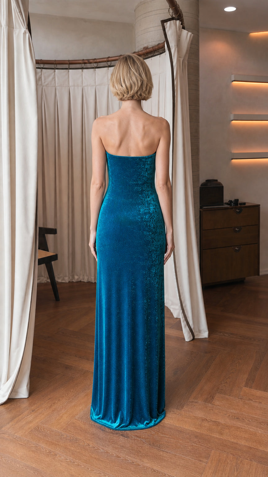 Back view of model in teal velvet gown