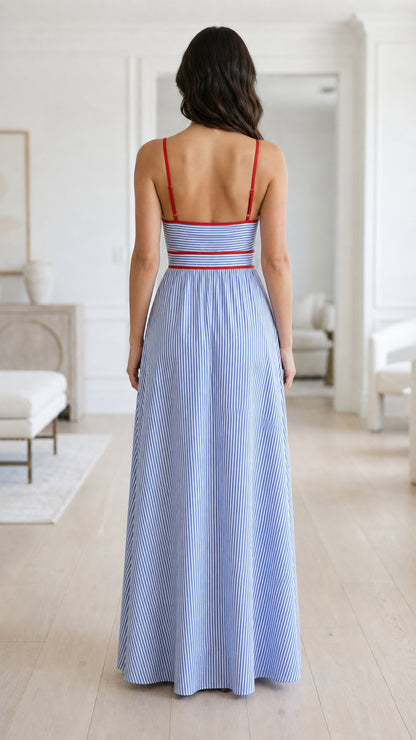 Back view showing strappy open back of blue striped maxi dress