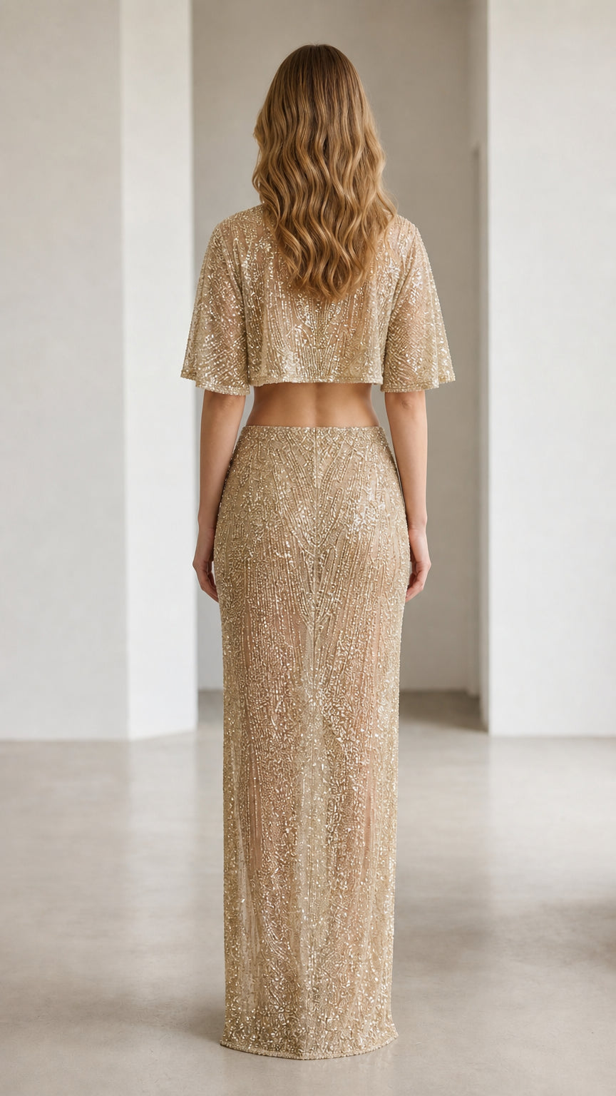 Back view of champagne sequin crop top and long skirt set