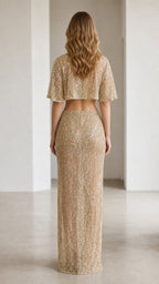 Back view of champagne sequin crop top and long skirt set
