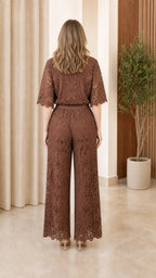Back view of model wearing brown lace two-piece set